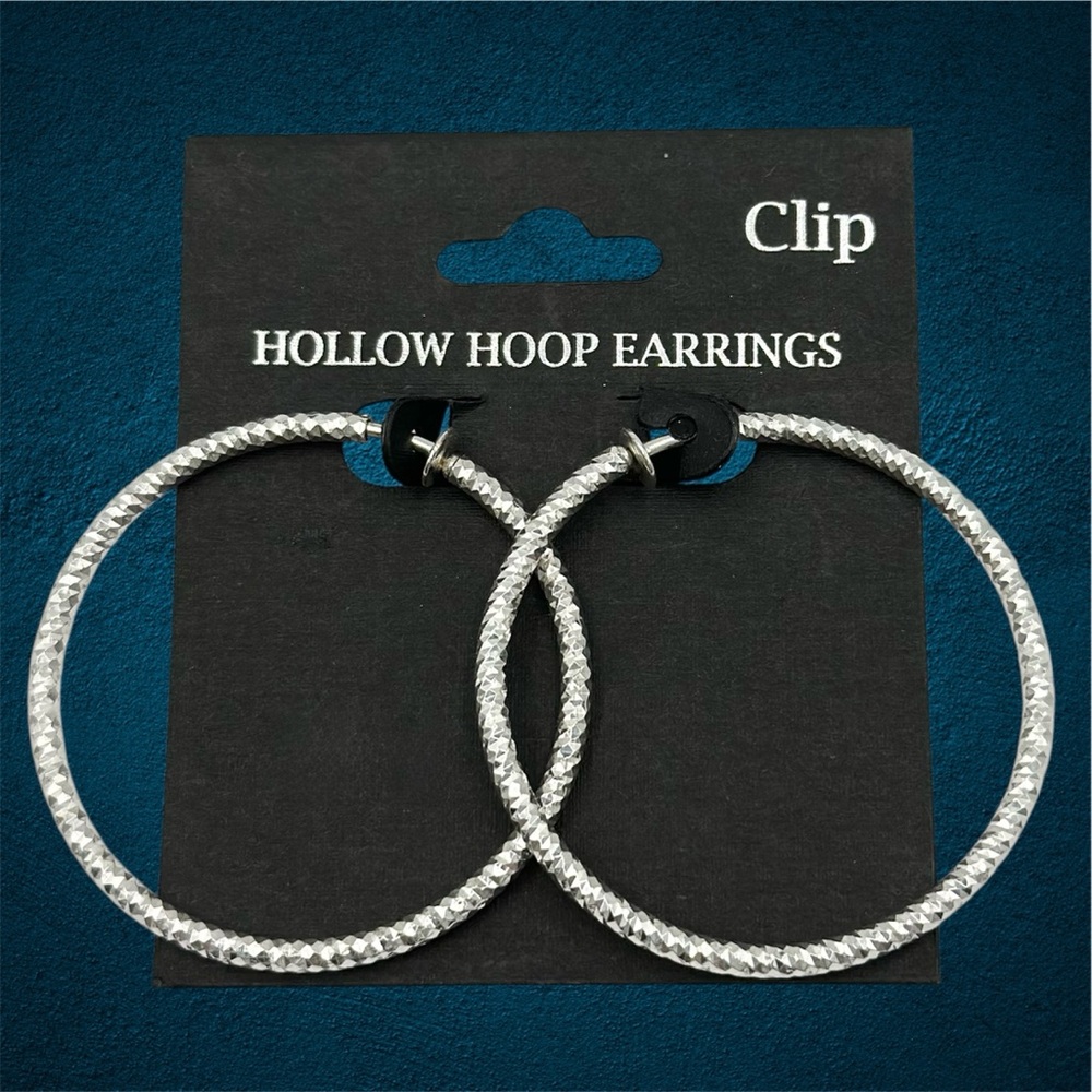 Spring Back Silver Tone Diamond Cut Clip On Hoop Earrings